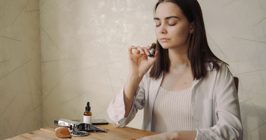lady-smelling-aromatherapy-essential-oil