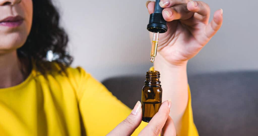 lady-using-essential-oil-for-home