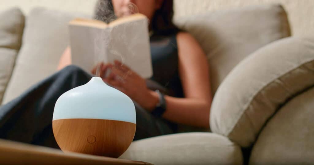 lady-diffusing-essential-oil-for-aromatherapy