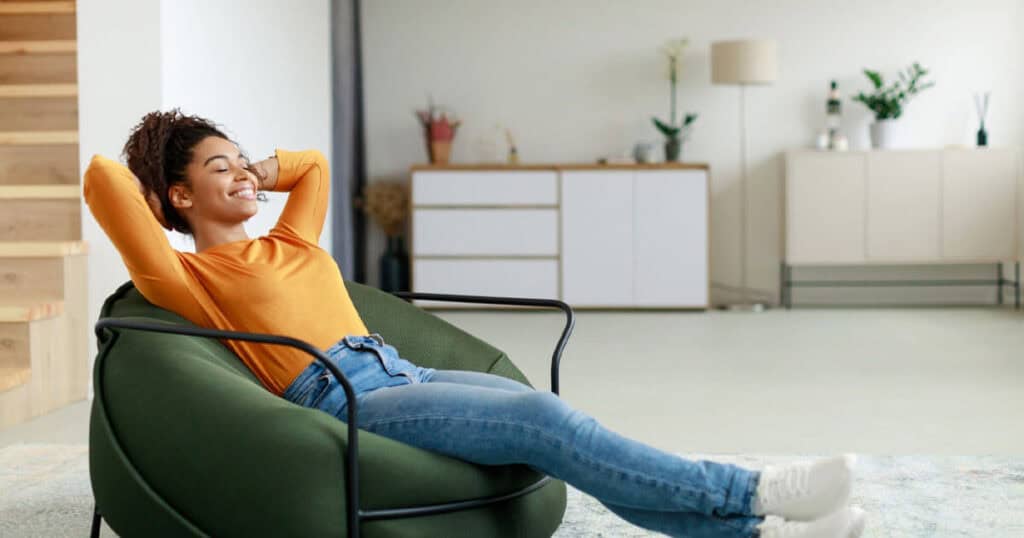 10 Surprising Ways Air Purifying Bags Can Freshen Your Home 21 lady-enjoying-the-fresh-air-in-living-room