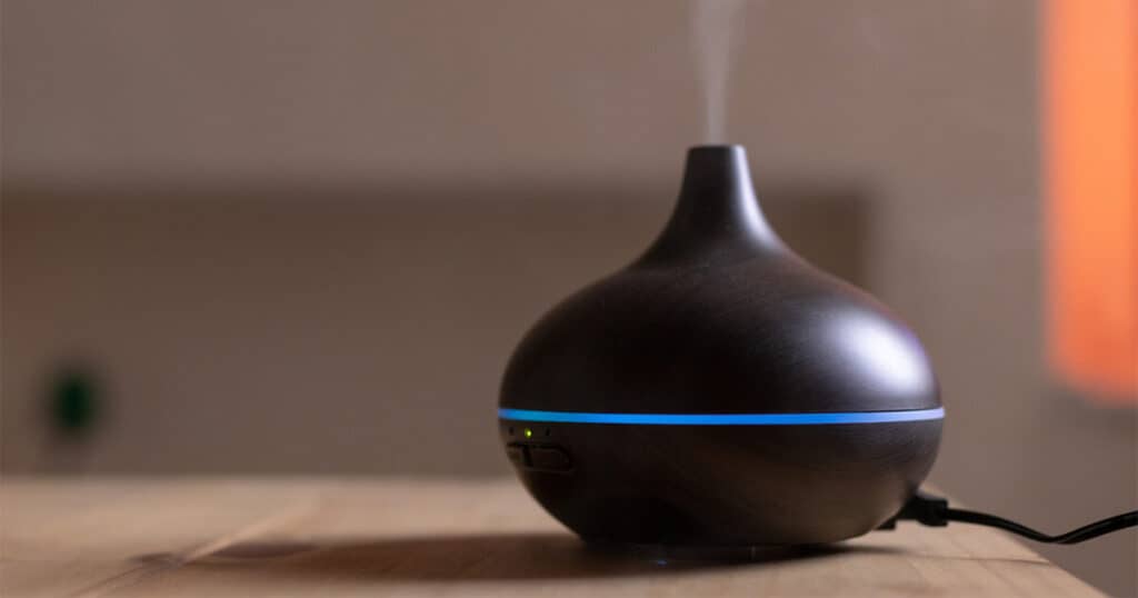 black-diffuser-in-a-wooden-table