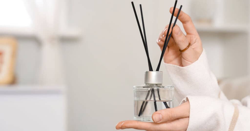 15 Best Reed Diffuser Oil Refills: A Buying Guide 27 lady-holding-a-reed-diffuser
