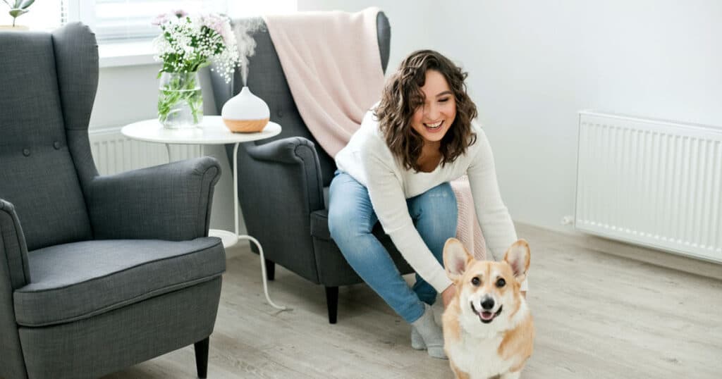 Pet-Safe And Allergy-Safe Home Fragrances: Expert Tips 21 lady with her corgi pet