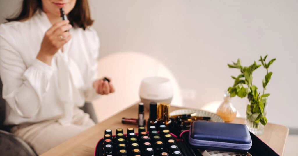 The 10 Healthiest Ways to Fragrance Your Home: A 2026 Guide 21 aromatherapist smelling essential oils